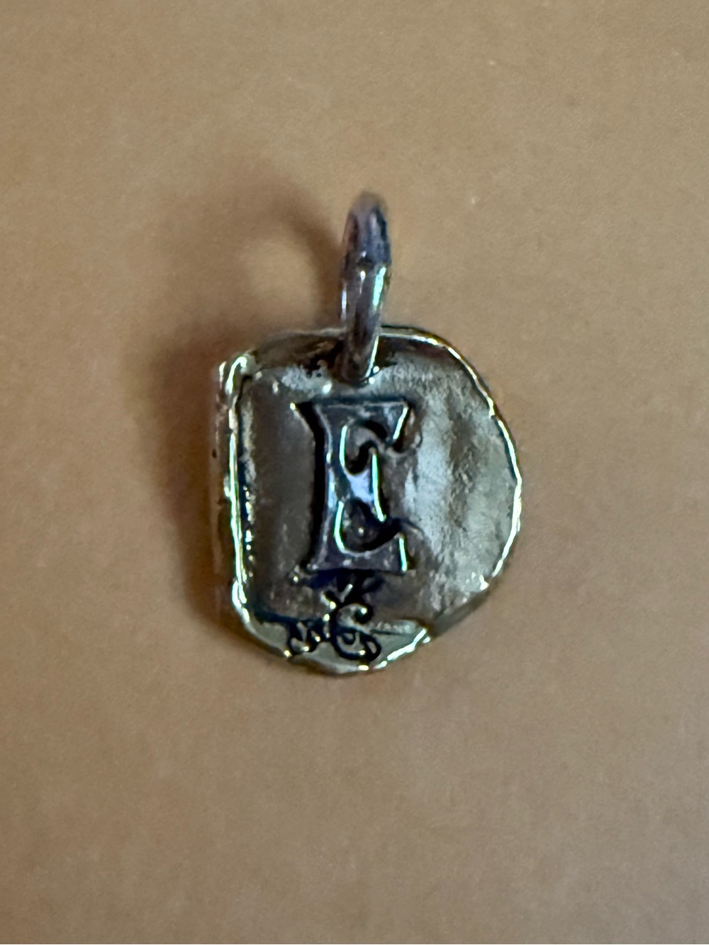 NWOT.  Waxing Poetic ‘E’ Charm